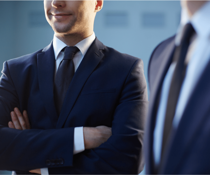 white man in suit smiling