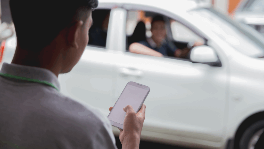 man ordering uber on his phone