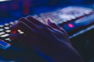 Person playing on Roblox in a dark room