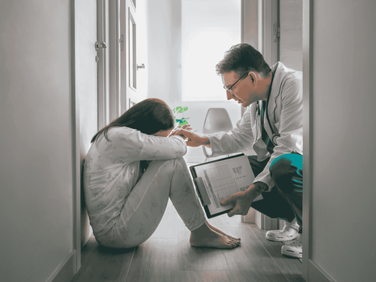 a psychiatrist talking to an upset child