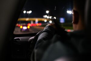 Lyft driver in California driving a car at night on the highway