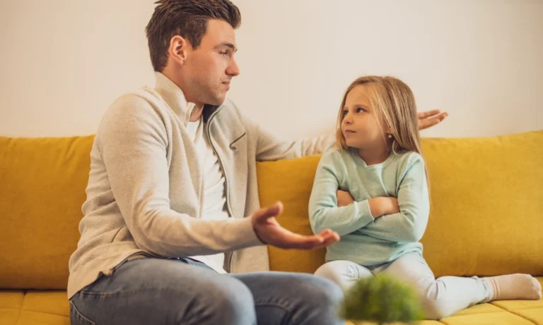 a adult man discussing with a young girl