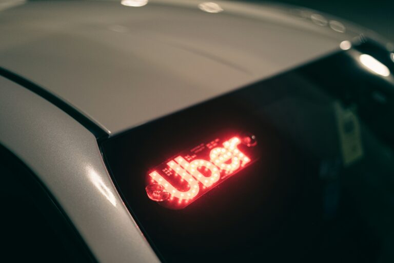 Close up photograph of an Uber logo on a rideshare vehicle