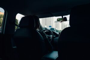Uber driver in dark, shadowed car