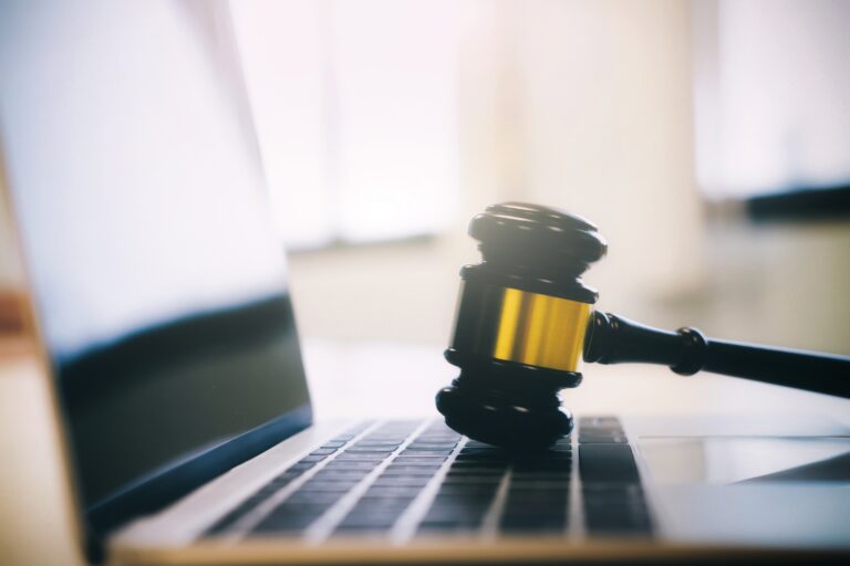 Law gavel on a computer keyboard. Law legal technology concept. judge gavel on computer on desk of lawyer.
